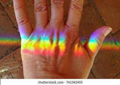 Rainbow Color Spectrum Light On The Back Of A Hand