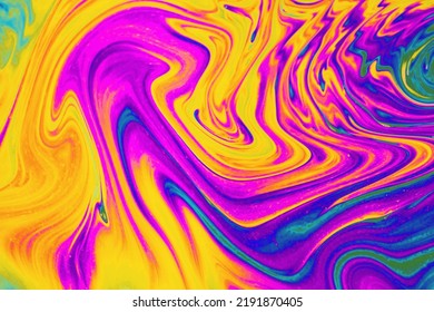 Rainbow colors. Psychedelic multi colored patterns background. Photo macro shot of soap bubbles
