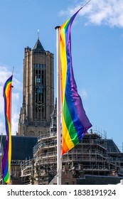 A Rainbow Flag In Front Of A Church