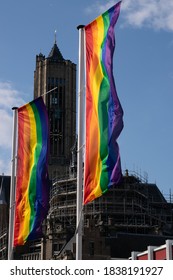 A Rainbow Flag In Front Of A Church