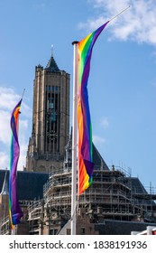 A Rainbow Flag In Front Of A Church