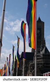 A Rainbow Flag In Front Of A Church