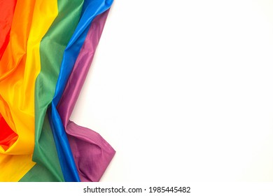 The rainbow flag (LGBT) isolated on a white background. Top view. Flat lay. Space for text. Love concept.
