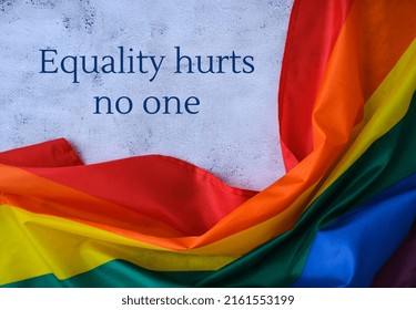 Rainbow Flag With Text EQUALITY HURTS NO ONE Message. Rainbow Lgbtq Flag Made From Silk Material. Symbol Of LGBTQ Pride Month. Equal Rights