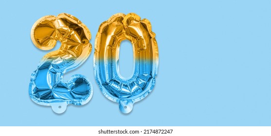 Rainbow foil balloon number, digit twenty on a blue background. Birthday greeting card with inscription 20. Anniversary concept. Top view. Numerical digit. Celebration event, template. Banner. - Shutterstock ID 2174872247
