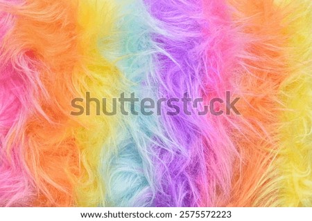 Rainbow fur background close up. Rainbow hair coloring. Bright abstract fur background with copy space.