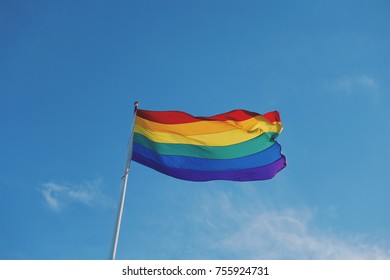 Rainbow Gay Pride Flag Flying Against Clear Blue Sky In Sydney, Australia