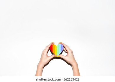 Rainbow Gay Pride Symbol Heart Shaped In Hands On White