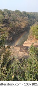 Rainbow in glimpse of waterfall