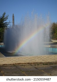 Rainbow Into Vertical Water Wall Fountain In A Park