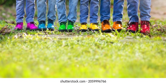 Rainbow Kids Shoes. Children And Dog Play Outdoor In Sunny Autumn Park. Hiking Footwear For Fall Walk Fun. Active Child Clothing And Warm Boots. Rain Weather Wear. Boy And Girl Fashion.