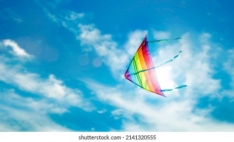 Rainbow Kites Floating In The Summer Sky It Symbolizes Outdoor Activities On A Bright Day.