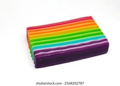 rainbow layer cake isolated on white background