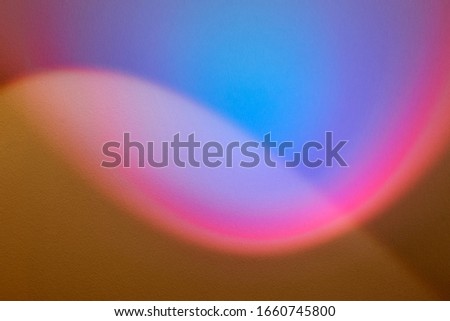 rainbow light beam on plaster wall. multicolored abstract design background