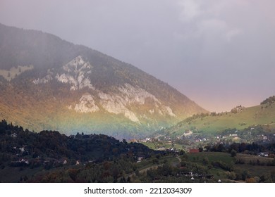 Rainbow in Magura and Pestera villages in Brasov County, Romania. - Shutterstock ID 2212034309
