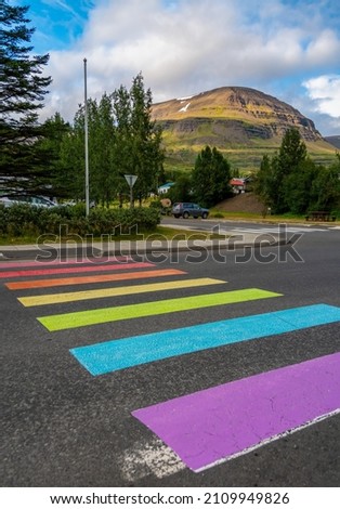 Rainbow marked crosswalk supporting equal rights for LGBT people community. Reydarfjordur - Eastfjords (Austfirðir), Iceland
