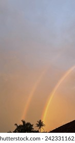 rainbow in the middle of the sunset
