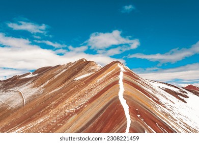 Rainbow mountain with blue sky and snow in Peru - Shutterstock ID 2308221459