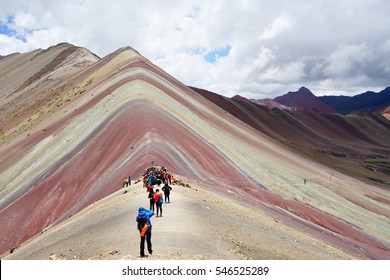 Rainbow Mountain With Hiker At Peru