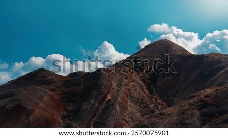Rainbow mountains and blue sly with clouds in Georgia