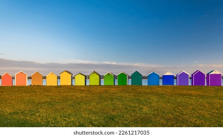 Rainbow of multi coloured beach huts at Hamworthy in Poole, Dorset - Powered by Shutterstock