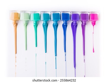 rainbow of nail polish isolated on a white background