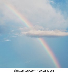 Rainbow On Cloud And Blue Sky After The Rain