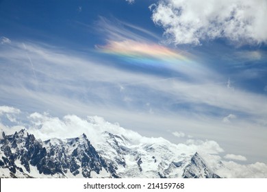 The rainbow on cloud in mountains