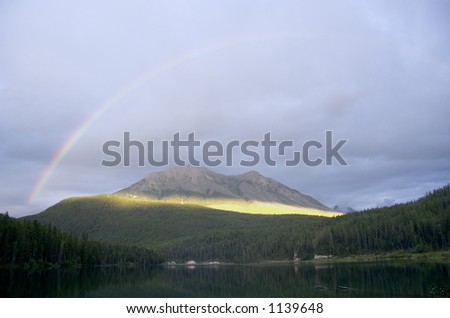 rainbow over the alces lake in the break of dawn - Located in the Whiteswan Lake Provincial Park in the Kootenay Range of the Rocky Mountains, British Columbia, Canada