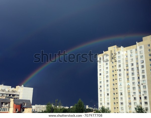Rainbow\
over the city. Rainbow in city. Rainy weather on city street. rain\
in city,rain drop on glass, Black clouds on  Heavy storm season\
Rainy day. Rainstorm in town Heavy rain\
clouds
