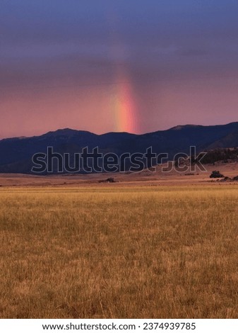 Rainbow over the mountains in montana