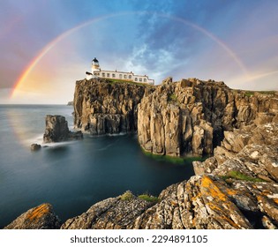 Rainbow over Neist Point Lighthouse on the green cliffs of the Isle of Skye, Scotland - Powered by Shutterstock