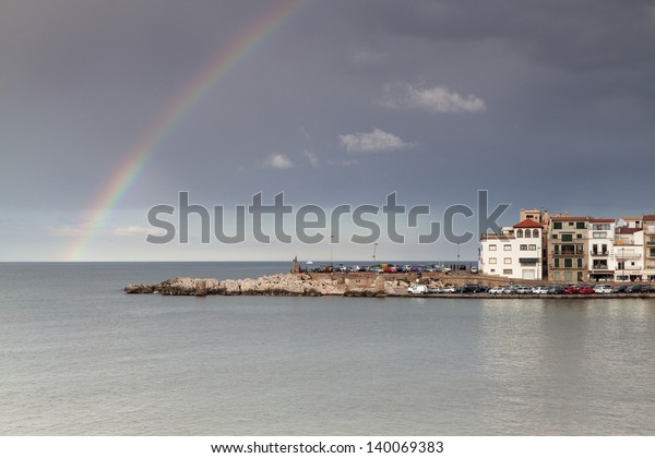The rainbow over\
the sea at a fisherman\'s little town/ Rainbow after the rain, in a\
Costa Brava little town