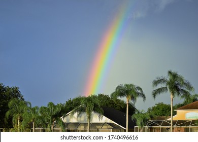 Rainbow Over Suburban In Residential Neighborhood Florida USA After The Storm