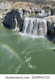 A rainbow over a waterfall