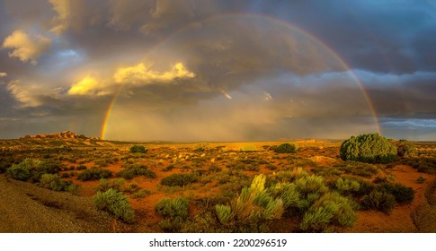 Rainbow panorama over the canyon desert. Canyon desert rainbow. Rainbow in canyon desert. Beautiful rainbow in canyon desert - Shutterstock ID 2200296519