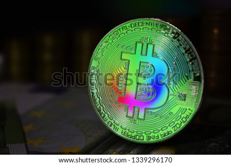 The rainbow physical bitcoin coin is BTC, preferably color green.