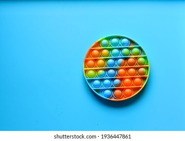 Rainbow Pop it fidget toy on a empty copy space background 