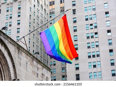 Rainbow Pride Flag Flying Waving On The Facade Of St. Bartholomew's Church. - New York, USA - June 2021