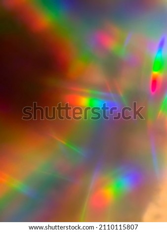 Rainbow prism fantasy effect with lots of streaks and beams of light for background or overlay