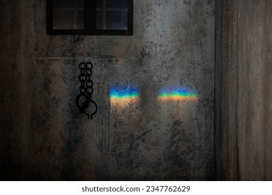 Rainbow reflection next to handcuffs 