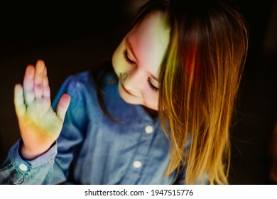 Rainbow Reflection On Face Of Little Funny Girl