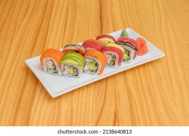 Rainbow roll is uramaki sushi roll stuffed with cucumber, avocado and crab sticks. It is prepared with various types of fish, most commonly tuna, salmon, white fish, horse mackerel, snapper, and eel - Powered by Shutterstock