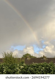 Rainbow in the sky over rooftops