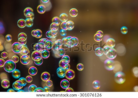 The rainbow soap bubbles from the bubble blower.