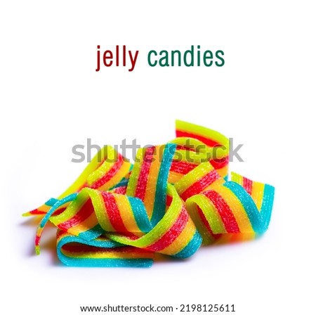 rainbow sour jelly candies strips in sugar sprinkle on white background.