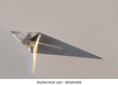 rainbow spectrum in a glass prism with shadow
