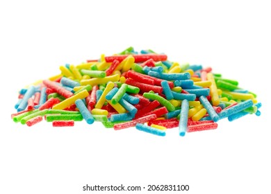 Rainbow Sprinkle For Confectionery. Colorful Confetti On A White Background, Close-up. Confectionery Multi-colored Sprinkles For Decoration. Pile Of Confectionery Sprinkles. Confectionery Decor.