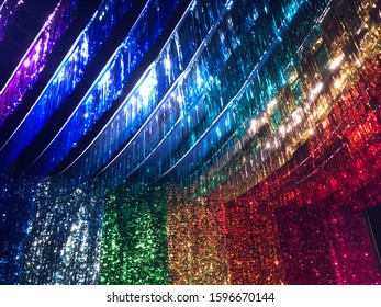 Rainbow Streamers Hanging From The Ceiling And Walls