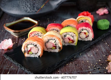 Rainbow Sushi Roll with salmon, eel, tuna, avocado, royal prawn, cream cheese Philadelphia, caviar tobica, chuka. Sushi menu. Japanese food. 